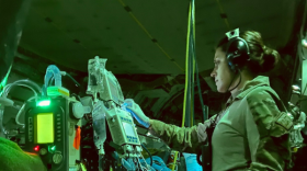  U.S. Air Force Capt. Katie Lunning, 379th Expeditionary Aeromedical Evacuation Squadron, critical care air transport team registered nurse, checks equipment on a C-17 Globemaster III in Kabul, Afghanistan.