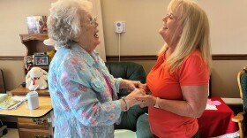 Sharon Hudson (left) has advanced Alzheimer's. But she smiles and giggles when her daughter, Lana Obermeyer, visits at the Good Samaritan Society nursing home in Syracuse, Nebraska.