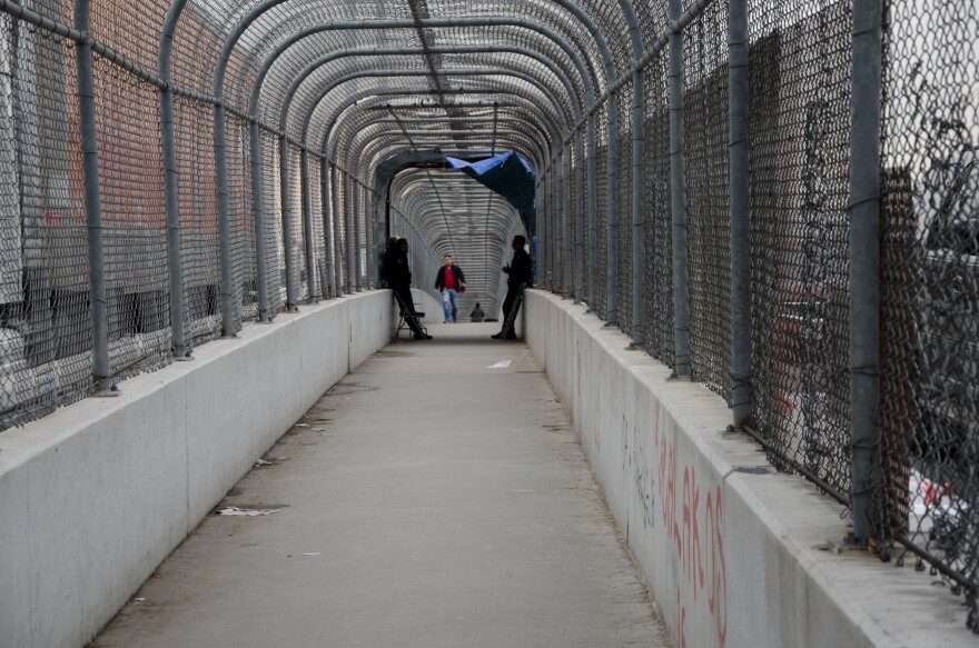 Border patrol agents wait on the U.S. side of the border on the Bridge of the Americas between El Paso, Texas and Juarez, Mexico to check identification of those crossing into the U.S. In recent months, border patrol agents have posted on the U.S. side of the border and required that migrants wait to cross due to space issues. U.S. Customs and Border Protection reported it arrested a record numbers of migrant family units in December. 