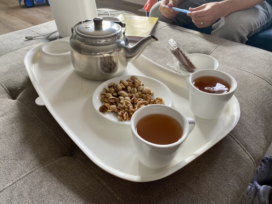  Reza Akrami enjoys tea in his new home in Sergeant Bluff, Iowa.