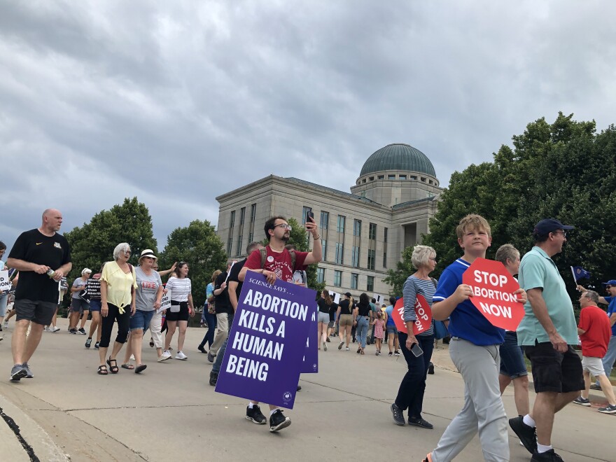  anti-abortion activists march to the iowa judicial branch building 