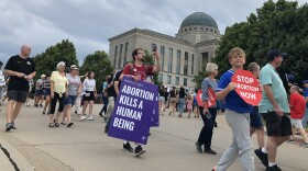  anti-abortion activists march to the iowa judicial branch building 