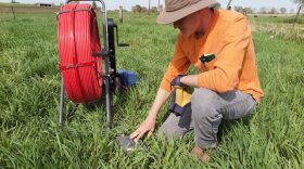 Clark Porter, environmental specialist at the Iowa Department of Agriculture and Land Stewardship, prepares an Iowa stream bank for a project to impede the flow of toxic nitrates into water.