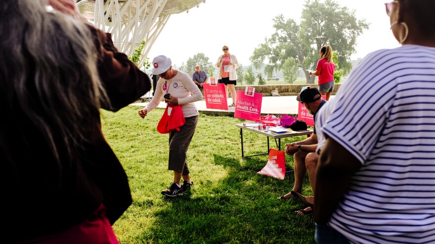 Abortion rights activists gather in Des Moines following the Iowa Supreme Court decision to not reinstate a six-week abortion ban.