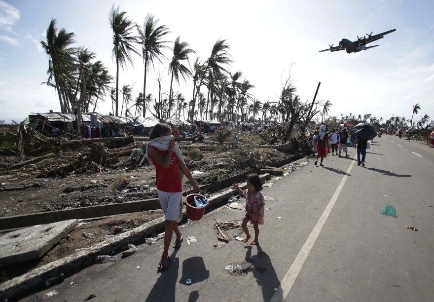 Residents of Tacloban in the central Philippines in 2013, after Typhoon Haiyan devastated the area. Scientists are renewing calls for a new Category 6 designation for the the most powerful hurricanes and typhoons, such as Haiyan.