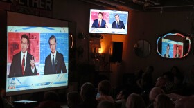 People gather in San Francisco to watch a debate on Fox News between California Gov. Gavin Newsom and Florida Gov. Ron DeSantis.