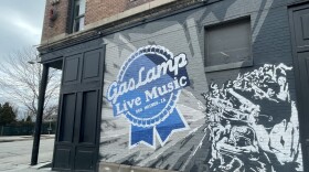 The mural on the outside of the Gas Lamp venue in Des Moines, which parodies the Pabst Blue Ribbon logo.