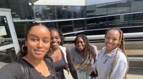 University of Iowa law student Sarah Rayes (left) takes a selfie before getting on the plane to Washington D.C. to participate in events celebrating Supreme Court nominee Ketanji Brown Jackson's confirmation process. She's traveling with fellow students (left to right) Stella Npuepnang, Cassandra Erbynn and Avery Brown.