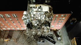 An overall aerial view of the partial collapse of the building at 324 Main St. in Davenport.