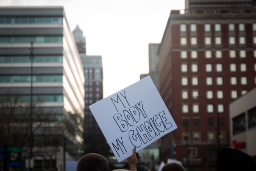 A protestor holds up a sign saying My Body My Choice