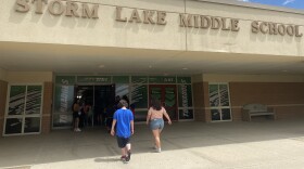 students walk into storm lake middle school