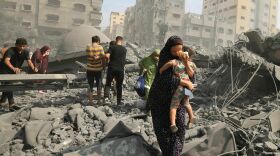 Palestinians evacuate the area following an Israeli airstrike on the Sousi mosque in Gaza City on October 9, 2023. Images of suffering, violence and death in Gaza and Israel have flooded the news since Oct. 7.