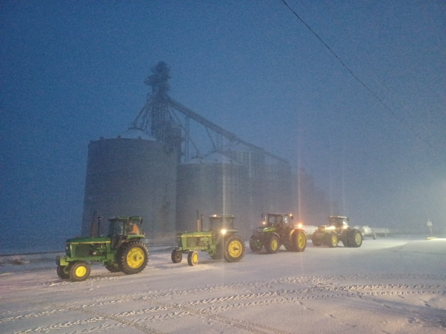 A caravan of tractors make their way to Winnebago High School on March 22, as part of the annual "Drive Your Tractor to School Day." While the National FFA Organization hit the one million mark last year, a record, the number of farms in the U.S. is declining.