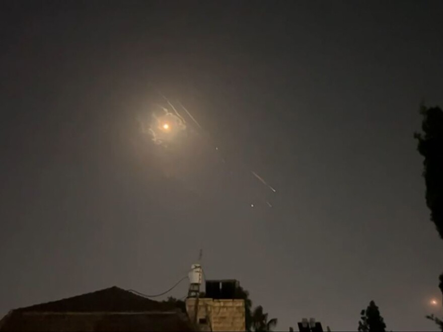 This video grab from AFPTV taken on Sunday shows explosions lighting up Jerusalem's sky during an Iranian attack on Israel.