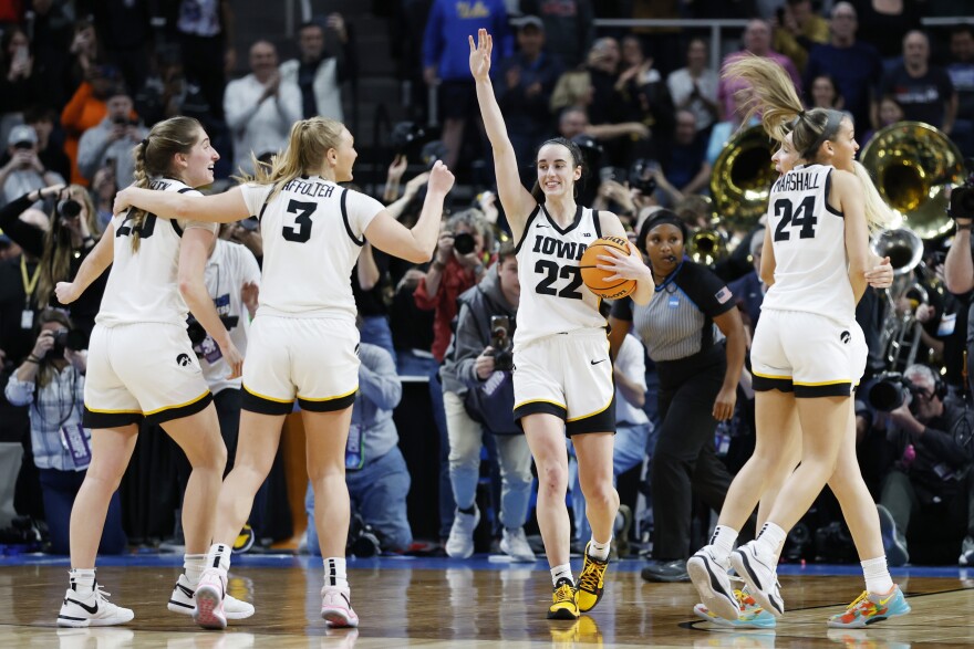 Caitlin Clark, #22 of the Iowa Hawkeyes, and her teammates celebrate after beating Louisiana State 94-87 in the Elite Eight round of the NCAA women's tournament on Monday.