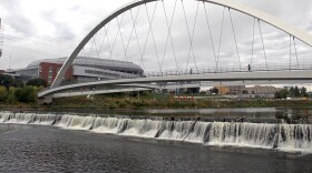 The Center Street Dam below the Iowa Women of Achievement Bridge in downtown Des Moines is one of three lowhead dams ICON plans to modify to make whitewater runs for paddlers on the Des Moines and Raccoon River.