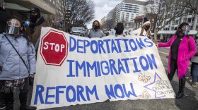 Pro-immigration reform activists hold a banner during the inauguration ceremony in Washington, D.C.