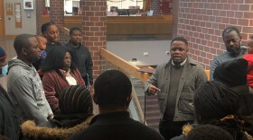 Simplice Kuelo is the president of UFCW Local 431. He speaks to Congolese residents of Johnson County after calling for the county to reopen its Direct Assistance Program on November 28, 2022.