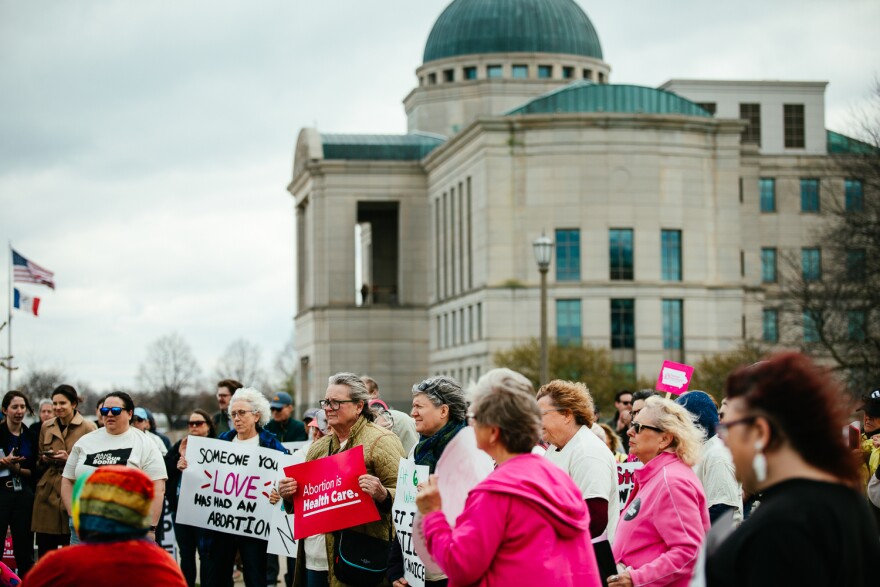 Iowans gather in front of the state Supreme Court building on Thursday ahead of the court's hearing on a 2023 law that would ban abortion after a fetal heartbeat is detected.