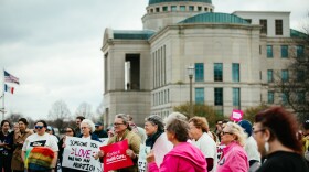 Iowans gather in front of the state Supreme Court building on Thursday ahead of the court's hearing on a 2023 law that would ban abortion after a fetal heartbeat is detected.