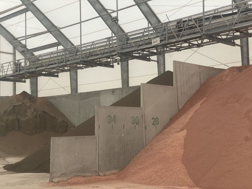 Piles of fertilizers at AGRILAND FS Woodbine in Woodbine, Iowa. Sales Manager Jason Sporrer was shocked to hear that Koch Industries would buy Iowa Fertilizer Co. “I know it’s a free market, and there’s some savings they can have by consolidation," he said, "but it does eliminate an option."