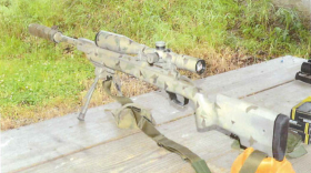 This is the weapon Sniper 1 fired in Baxter Springs, Kansas in March 2022. It is a .308 Winchester bolt action rifle with a mounted optical scope, bipod, sling and wrapped suppressor.