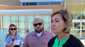 Gov. Kim Reynolds speaks to reporters Wednesday in Belmond.