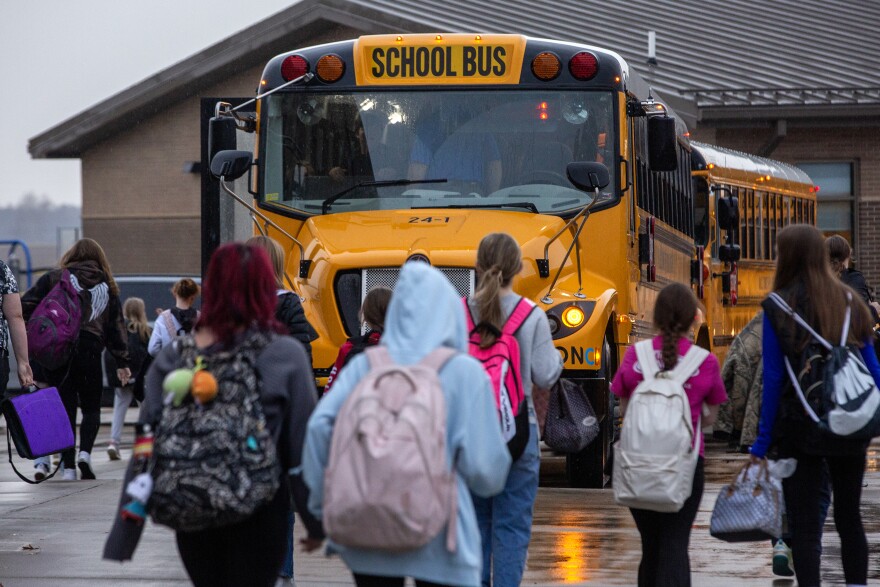 Kids attending the Ralls County School District board buses at the end of the school day on Monday, Nov. 20, 2023, in Center, Mo. While most of the district’s buses are powered by gas or diesel, it has recently added two electric school buses to its fleet. The buses were obtained via Inflation Reduction Act grants, intended to introduce electric buses to rural and high-need school districts. 