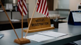  voter registration forms sit on a counter in an elections office