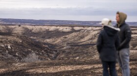 Landowners Abby Burkham-Breeding, left and her husband Austin Breeding, look over a portion of the 2,000 acres that was burned on their property by the Smokehouse Creek Fire on Thursday, Feb 29, 2024, in Roberts Country, Texas.