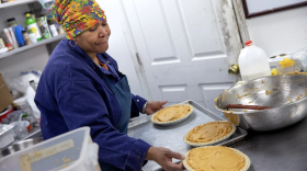 Pastry chef Carla Jones loads a trio of sweet potato pies onto a tray destined for the oven on Nov. 15 at Ol’ Henry’s Restaurant in Berkeley, Missouri. Sweet potato pie is a significant touchstone of African American culture, especially around Thanksgiving.