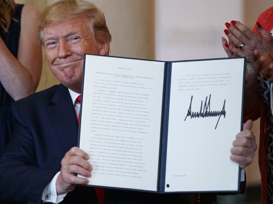 The executive order on drug price transparency that President Trump signed Monday doesn't spell out specific actions; rather, it directs the department of Health and Human Services to develop a policy and then undertake a lengthy rule-making process.