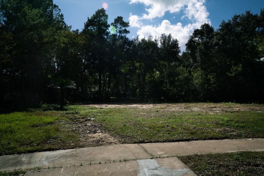 An empty lot where a house once stood in Houston. The former residents moved because of flood damage. A new study suggests that people are moving away from the most flood-prone neighborhoods in cities that are otherwise growing in population.