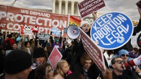 Anti-abortion and abortion rights activists protest during the 50th annual March for Life rally in front of the U.S. Supreme Court on Jan. 20, 2023 in Washington, D.C.