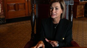 Gov. Kim Reynolds in her office at the Iowa State Capitol during an interview with Iowa Public Radio's Clay Masters on Aug. 9.