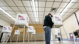 In this Oct. 20, 2020, file photo, Kelly Wingfield, of Urbandale, Iowa, fills out his ballot during early voting for the general election in Adel, Iowa. As it has for more than 170 years, The Associated Press will count the vote and report the results of presidential, congressional and state elections quickly, accurately and without fear or favor on Nov. 3 and beyond.