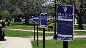 Outside the admissions building at Iowa Wesleyan, parking signs welcome prospective students. However March 28, the university announced it would close after the semester. The U.S. Department of Agriculture will take ownership of Iowa Wesleyan University May 31.