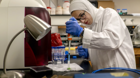 University of Missouri Ph.D. student Mai Abuhelwa demonstrates how one of the new sensors detects salmonella contamination. This sensor uses a laser and fiber optic cables to sense small concentrations of the bacteria.<br/> 