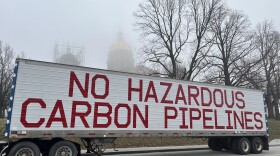  A message protesting carbon capture pipelines sits outside the Iowa Capitol.