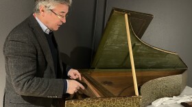 Darryl Martin examines a harpsichord during a tour at the National Music Museum. Martin moved to Vermillion from Belgium for the chance to manage one of the world’s most significant instrument collections and to lead one of the only graduate programs specializing in the history of musical instruments.