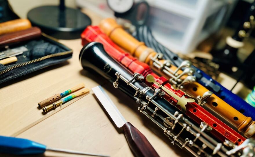 Jeffrey Paul's work table at his home in Sioux Falls, South Dakota. Two instruments created for his new concerto are to the right.