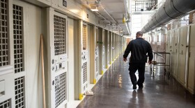 Lt. Keith Immerfall walks past prison cells at Waupun Correctional Institution, a maximum security prison in Waupun, Wis. If the more than 1,200 prisoners at the facility are still incarcerated there on April 1, the next Census Day, the Census Bureau will officially consider them residents of Waupun for the 2020 national head count.