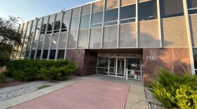 Waterloo City Hall's red marble and stone walkway at sunset.