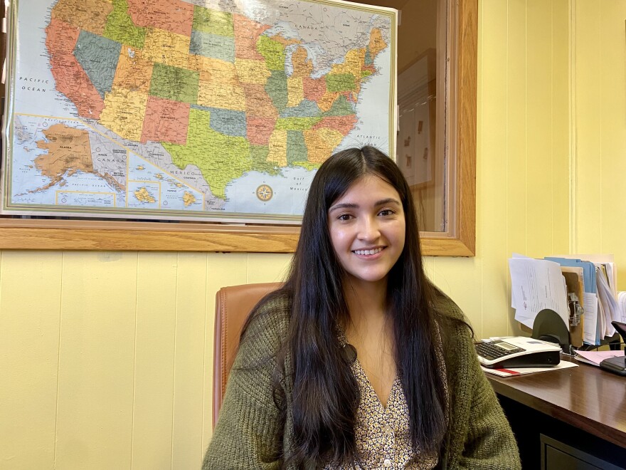 Mercedes Dimas sits in her office at the Mary J. Treglia Community House in Sioux City, Iowa. She's resettled 20 Afghan refugees in the area since November.