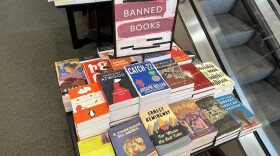 A pile of banned books at a Barnes and Noble. State education officials are offering details about how they’ll enforce a ban on sexually graphic books at Iowa schools.