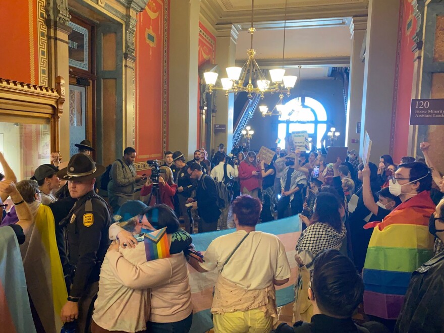 people protest a bill putting restrictions on transgender iowans at the state capitol