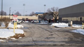  Police cars sit in the parking lot of the business park complex occupied by alternative education program Starts Right Here.