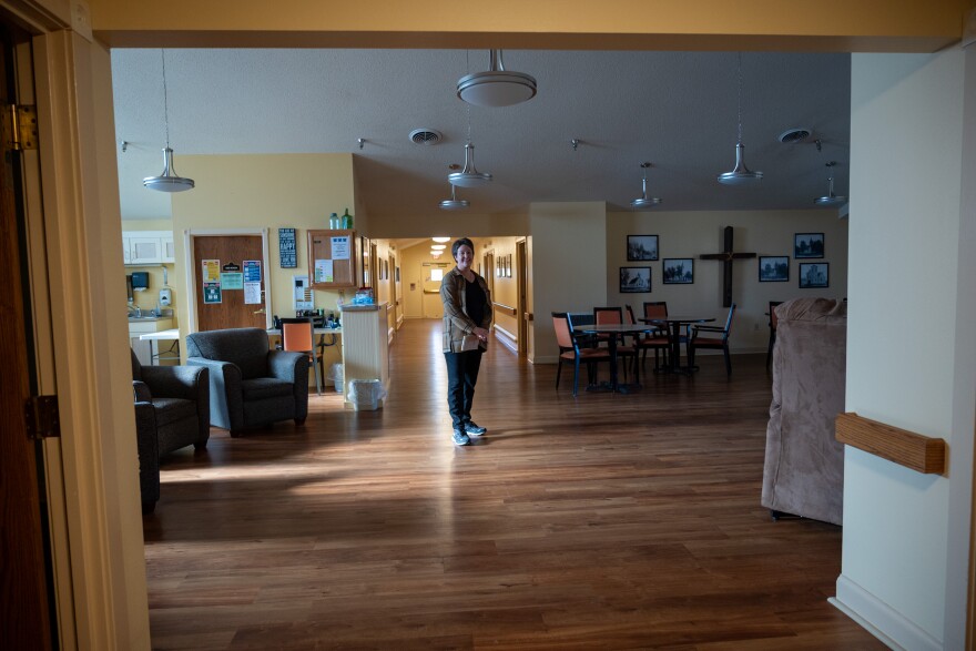 Wendy Nelson, the administrator of the Prairie View Nursing Home in Sanborn, Iowa, stands in the facility's empty memory care unit. It closed in February 2022 due to staffing shortages.