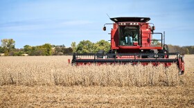  A farmer in northwest Missouri runs a combine through a field of soybeans in November 2022.