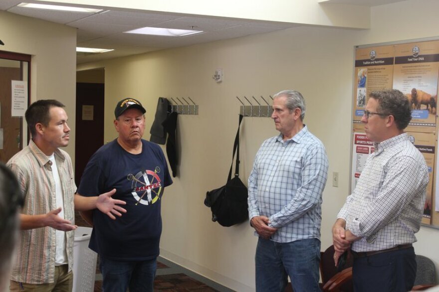 Santee Sioux Tribal Vice Chairman Kameron Runnels (left) speaks with U.S. Rep. Adrian Smith (right) during the Nebraska Congressman's visit to Santee on August 22, 2023. While $1.75 million has been allocated for the Santee water infrastructure request as part of an appropriations bill, the measure still must get approval in the U.S. House and Senate.